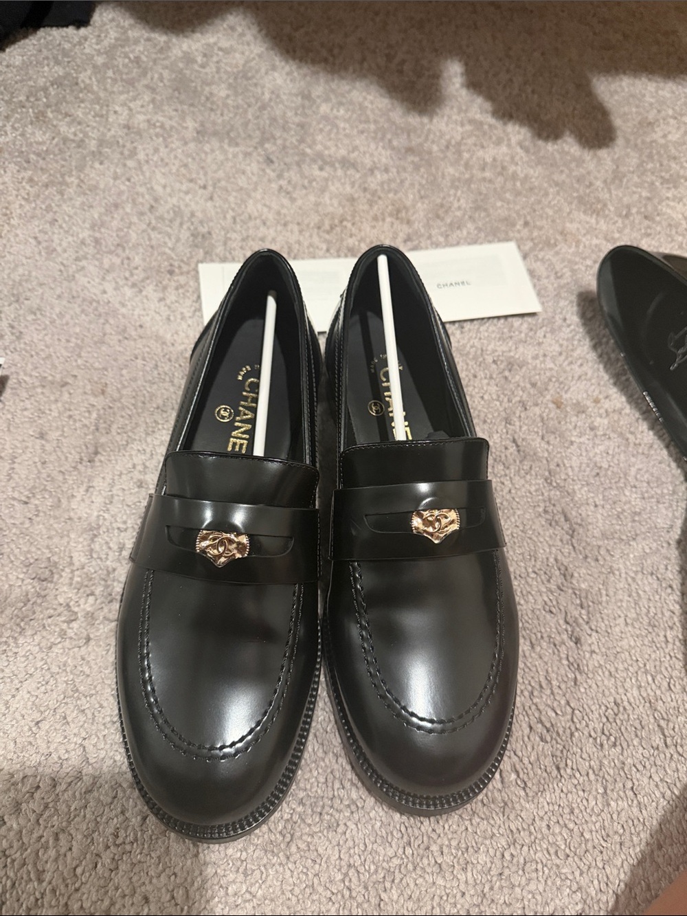 CHANEL Black Leather Loafers with Gold Heart Accent